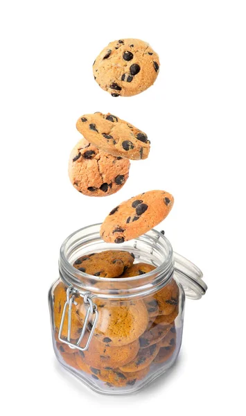 Tasty Chocolate Chip Cookies Falling Glass Jar White Background — Zdjęcie stockowe