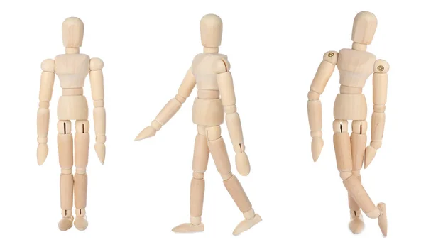 不同姿势的木制人体模型设置在白色背景上 — 图库照片