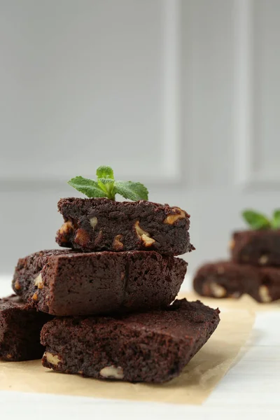 Delicious Chocolate Brownies Nuts Fresh Mint White Table Closeup — Stock Photo, Image