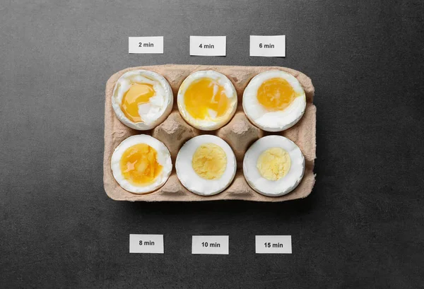 Different Cooking Time Readiness Stages Boiled Chicken Eggs Dark Grey — Stockfoto