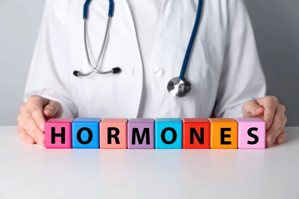 Doctor Word Hormones Made Colorful Cubes White Table Closeup — Stockfoto