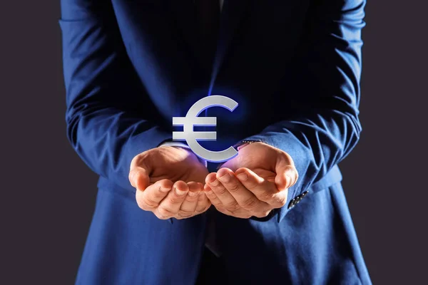 Man Demonstrating Virtual Euro Sign Grey Background Closeup — Zdjęcie stockowe