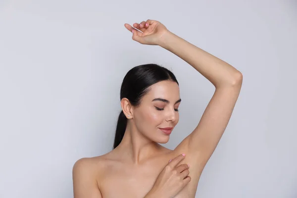 Young Woman Showing Smooth Skin Epilation White Background — Stock Fotó