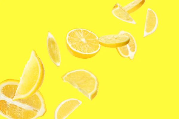 Fresh Ripe Lemons Flying Yellow Background — Fotografia de Stock