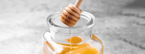 Dripping Tasty Honey Dipper Glass Table Closeup Banner Design — Stockfoto
