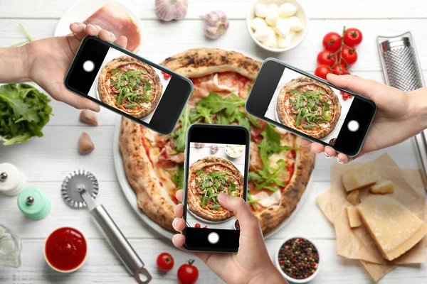 People Taking Pictures Tasty Pizza White Wooden Table Top View — Photo