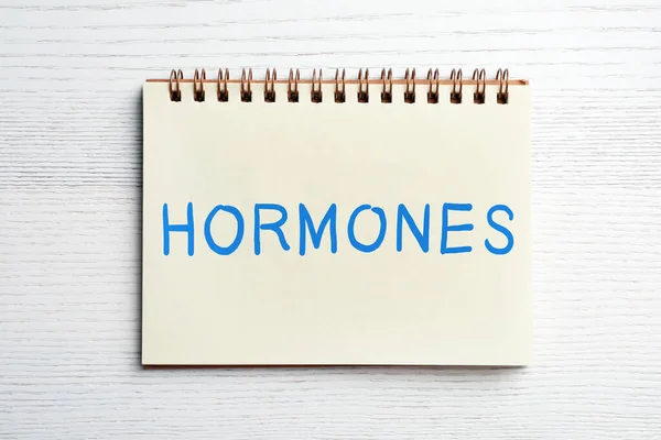 Notebook Word Hormones White Wooden Table Top View — Foto de Stock