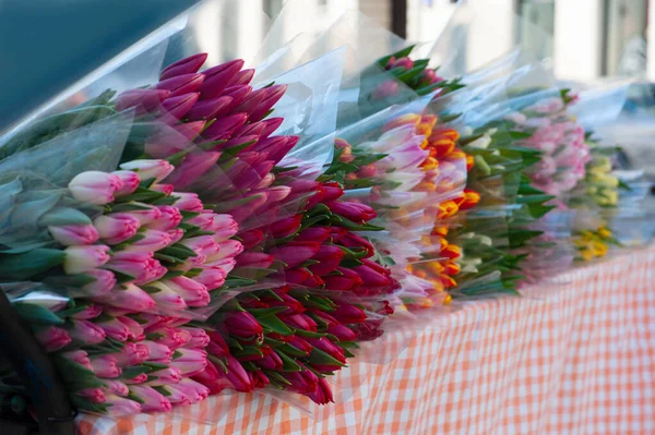 Assortment Bright Tulip Flowers Table Store Outdoors — Fotografie, imagine de stoc
