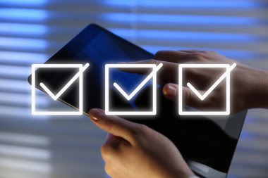 Illustration of check boxes with marks and woman using tablet indoors, closeup