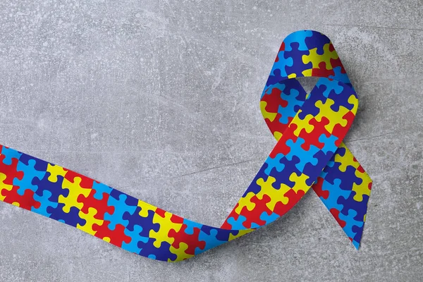 World Autism Awareness Day Colorful Puzzle Ribbon Light Grey Stone — ストック写真