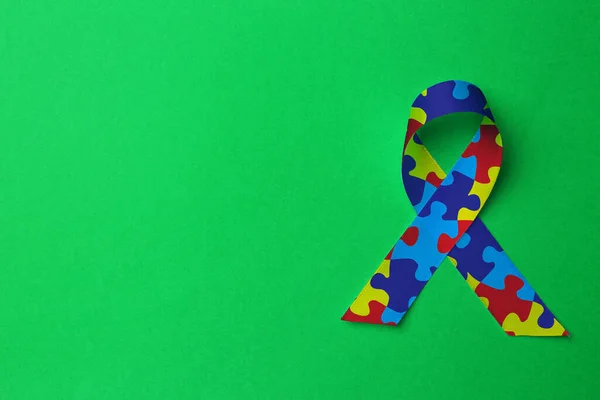 World Autism Awareness Day Colorful Puzzle Ribbon Green Background Top — ストック写真