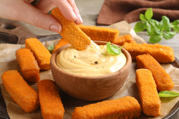 Woman Dipping Delicious Chicken Nuggets Cheese Sauce Table Closeup — 图库照片
