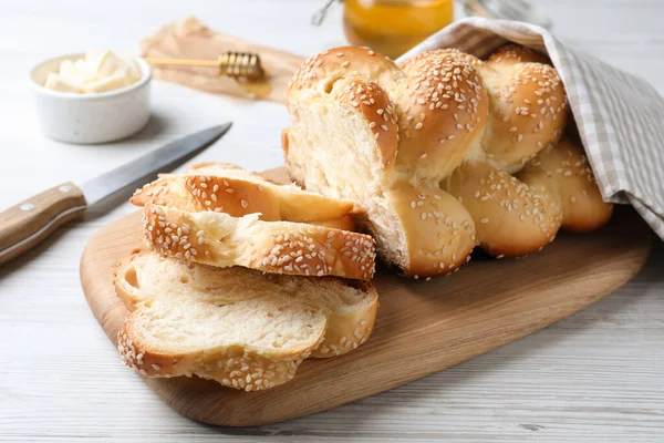 Cut Freshly Baked Braided Bread Knife Butter White Wooden Table — Fotografia de Stock