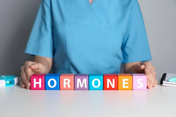 Doctor Word Hormones Made Colorful Cubes White Table Closeup — Stockfoto