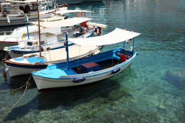 Beautiful view of coastal city with different boats on sunny day