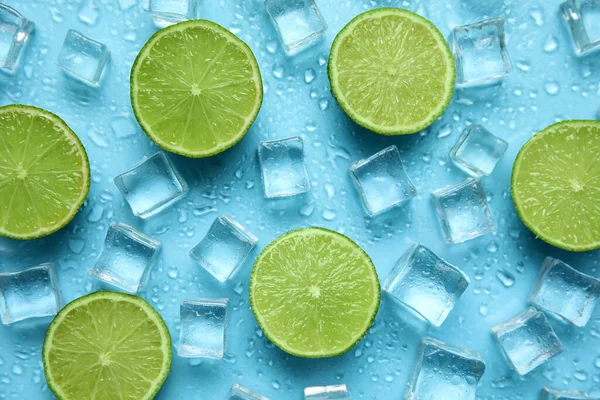 Ice Cubes Cut Limes Turquoise Background Flat Lay Ingredients Refreshing — ストック写真