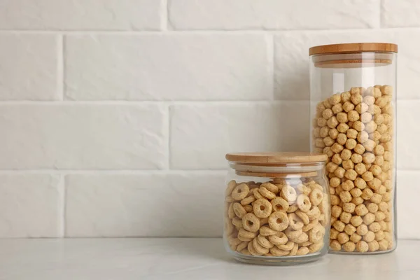 Glass Containers Different Breakfast Cereals White Countertop Brick Wall Space — Foto de Stock