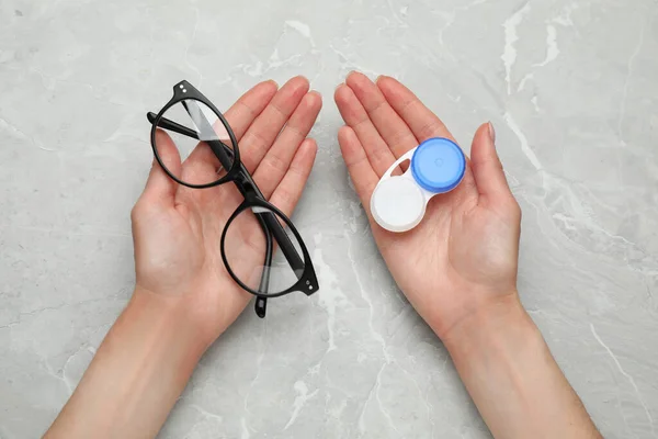 Woman Holding Case Contact Lenses Glasses Light Grey Marble Table — Stock fotografie