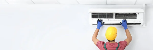 Male Technician Checking Air Conditioner Indoors Space Text Banner Design — Stockfoto