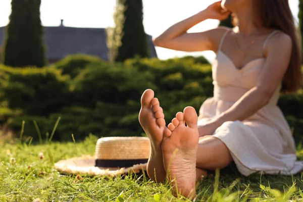 Woman Sitting Barefoot Green Grass Outdoors Closeup Space Text — Stock Fotó