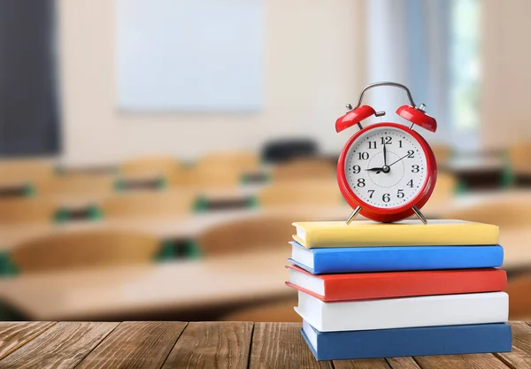 Red Alarm Clock Different Books Wooden Table Classroom Space Text — Stockfoto