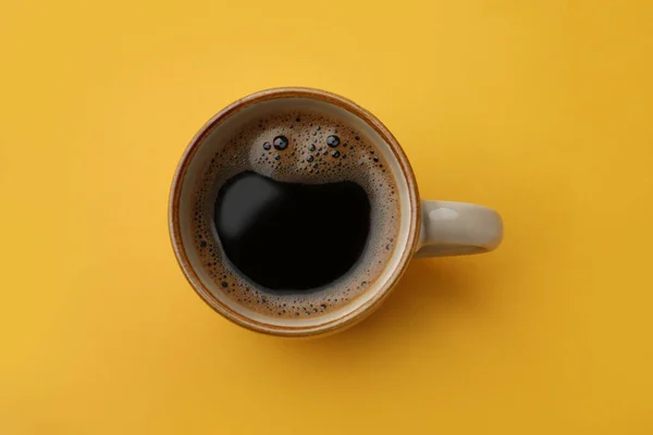 Cup Delicious Black Coffee Yellow Background Top View — ストック写真