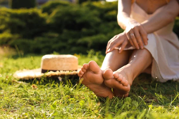 Woman Sitting Barefoot Green Grass Outdoors Closeup Space Text — Stock Fotó