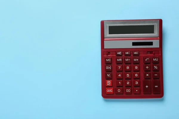 Red Calculator Light Blue Background Top View Space Text — ストック写真