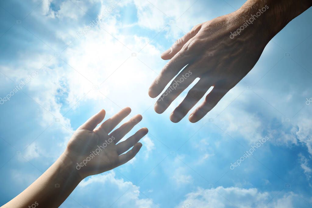 Godparent with child and beautiful blue sky with fluffy clouds on background, closeup