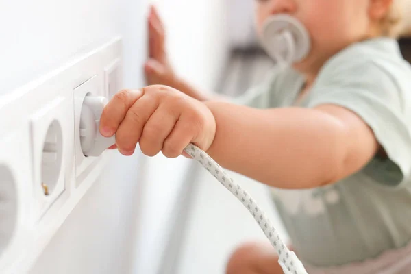 Cute Baby Playing Plug Electrical Socket Home Closeup Dangerous Situation — 스톡 사진