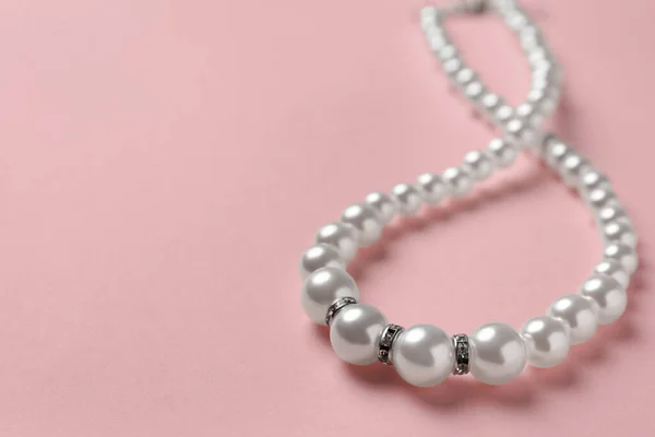 Elegant Necklace Pearls Pink Background Closeup Space Text — Foto Stock