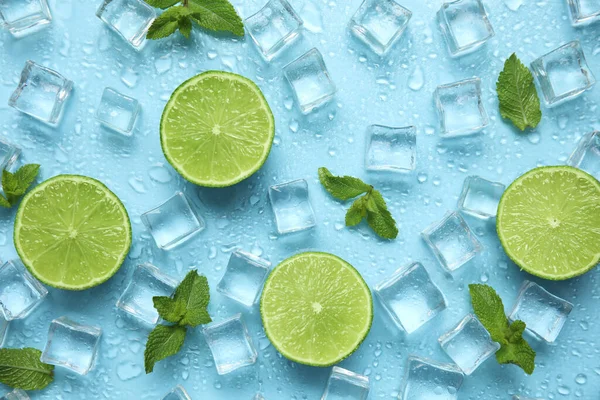 Ice Cubes Mint Cut Limes Turquoise Background Flat Lay Ingredients — Stockfoto