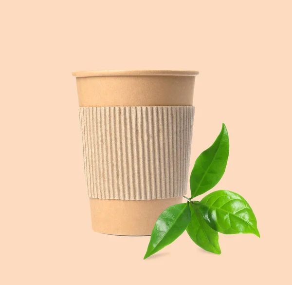 Takeaway Paper Coffee Cup Cardboard Sleeve Green Leaves Beige Background — Stockfoto