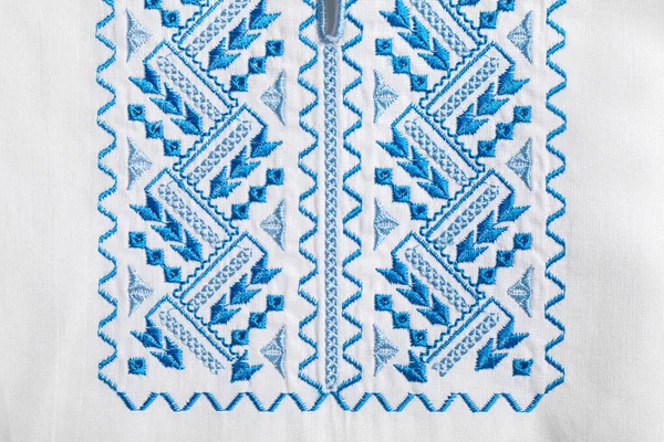 Beautiful Light Blue Ukrainian National Embroidery White Fabric Top View — Stockfoto