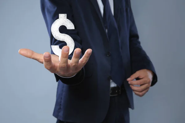 Man Demonstrating Virtual Dollar Sign Light Grey Background Closeup — Stok fotoğraf