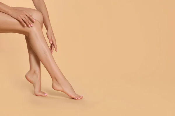 Woman Beautiful Long Legs Beige Background Closeup Space Text — 图库照片