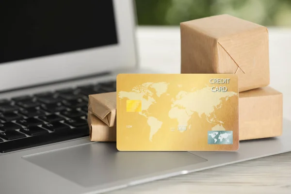 Online Payment Concept Bank Card Small Boxes Laptop White Table — 스톡 사진