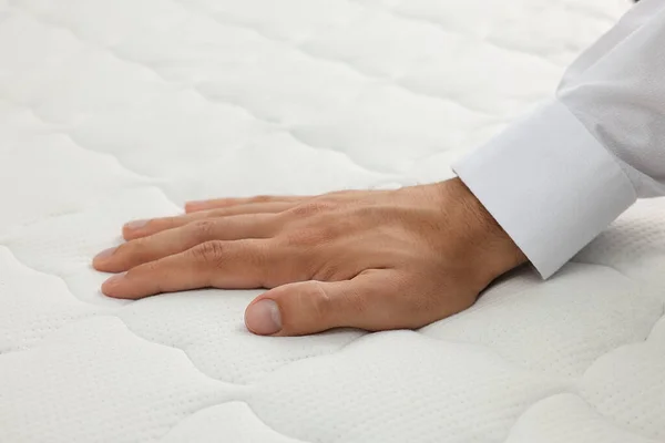 Man Touching Soft White Mattress Closeup View — Zdjęcie stockowe