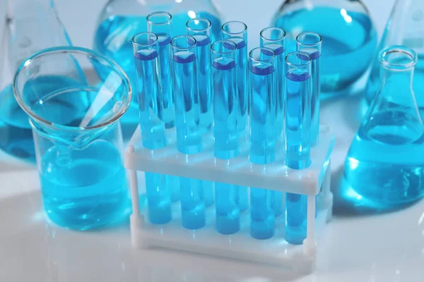 Laboratory Glassware Blue Liquid Light Background — Foto Stock