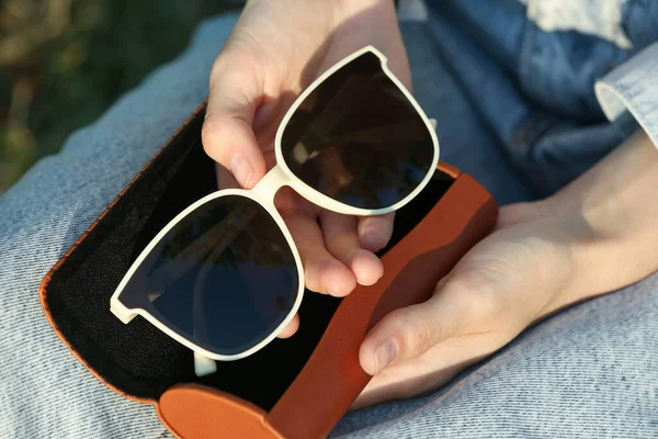 Woman Holding Sunglasses Brown Leather Case Outdoors Sunny Day View — 스톡 사진