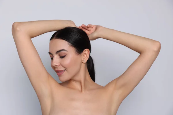 Young Woman Showing Smooth Skin Epilation White Background — Stok fotoğraf