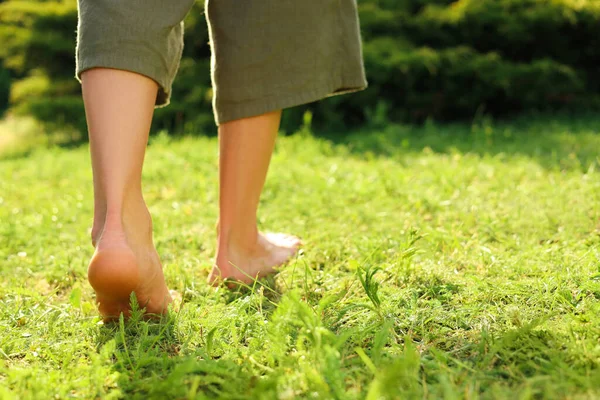 Woman Walking Barefoot Green Grass Outdoors Closeup Space Text — Φωτογραφία Αρχείου