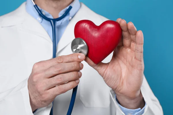 Doctor Stethoscope Red Heart Light Blue Background Closeup Cardiology Concept — Stockfoto