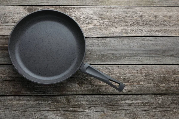 New Non Stick Frying Pan Wooden Table Top View Space — 图库照片
