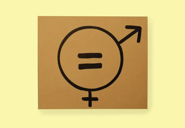 Gender equality. Card with equal sign, male and female symbols on blue background, top view