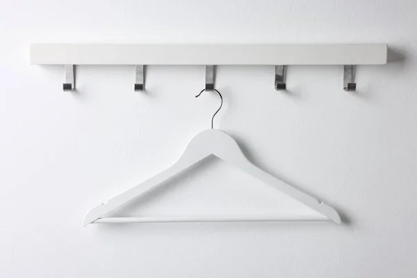 Rack Empty Clothes Hanger White Wall — 스톡 사진