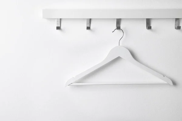 Rack Empty Clothes Hanger White Wall — 스톡 사진