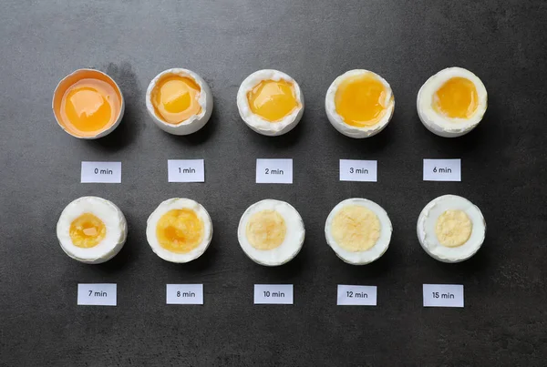 Different Cooking Time Readiness Stages Boiled Chicken Eggs Dark Grey — Stockfoto