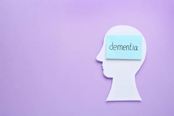 Human Head Cutout Note Word Dementia Violet Background Top View — Foto de Stock