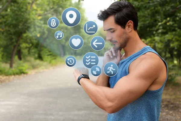 Young Man Checking Fitness Tracker Training Park — Stockfoto